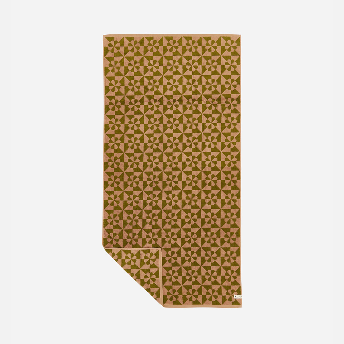 Bath towel with quilt-inspired star pattern on a light background.