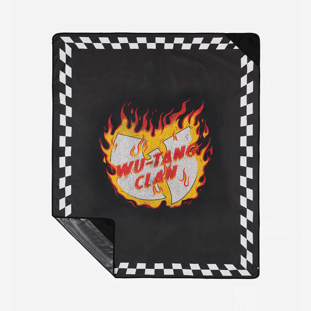 Picnic blanket, black with flaming logo and checkered border, outdoor use.