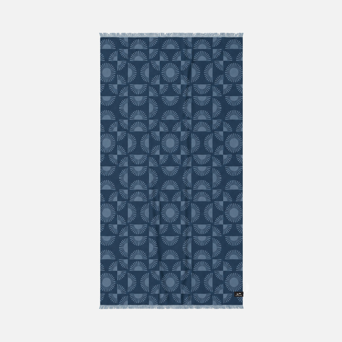 Turkish towel, dark blue indigo with sunburst and arch patterns, fringed ends.