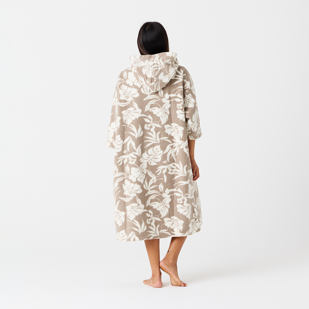 Fleece poncho with tropical print and floral-patterned hooded robe displayed together.