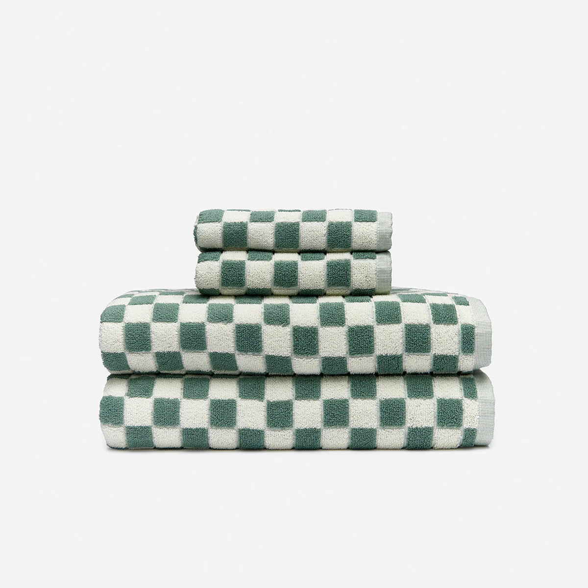 Absorbent sage towels in three sizes, stacked.