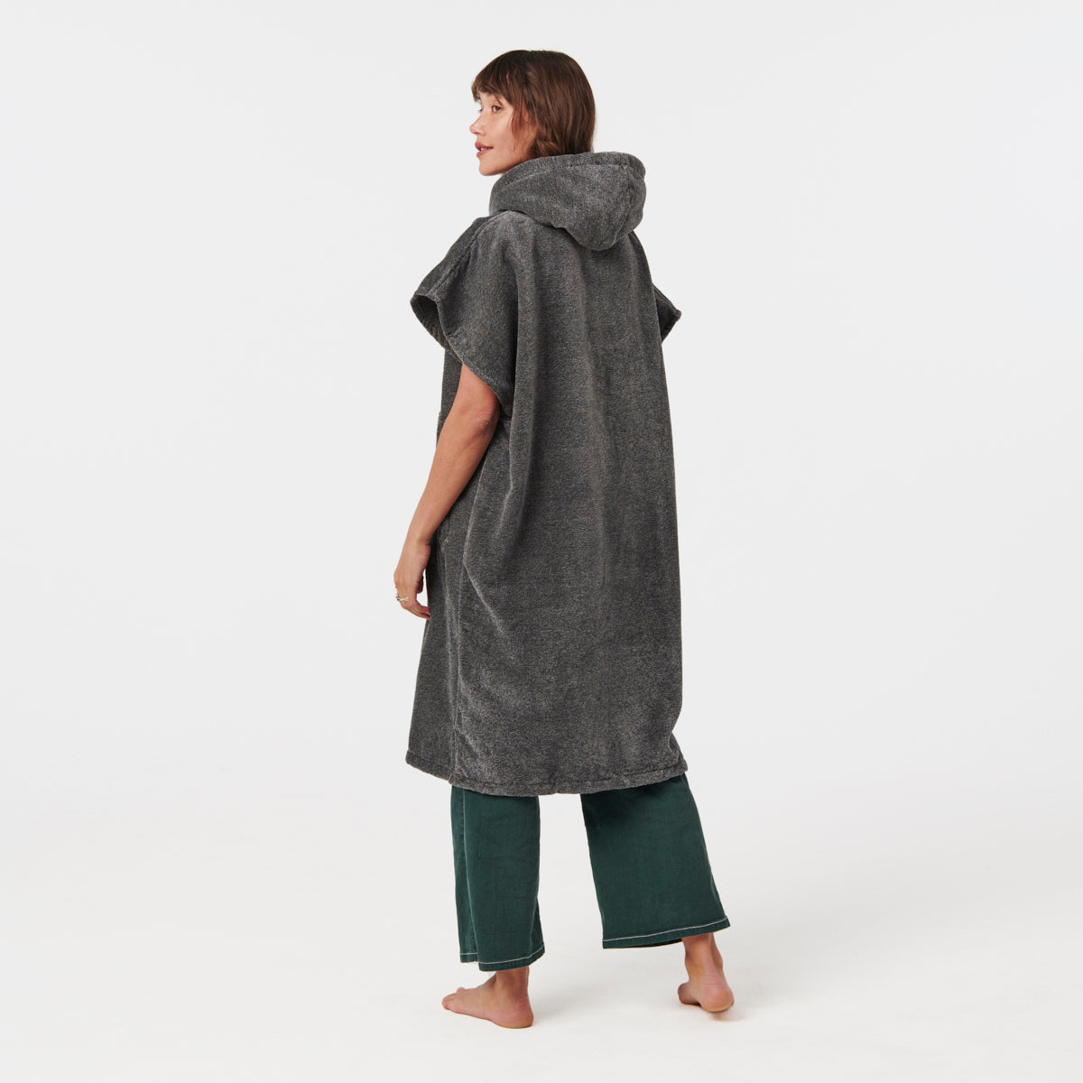 Hooded gray towel poncho with green pants, cotton material, front view.