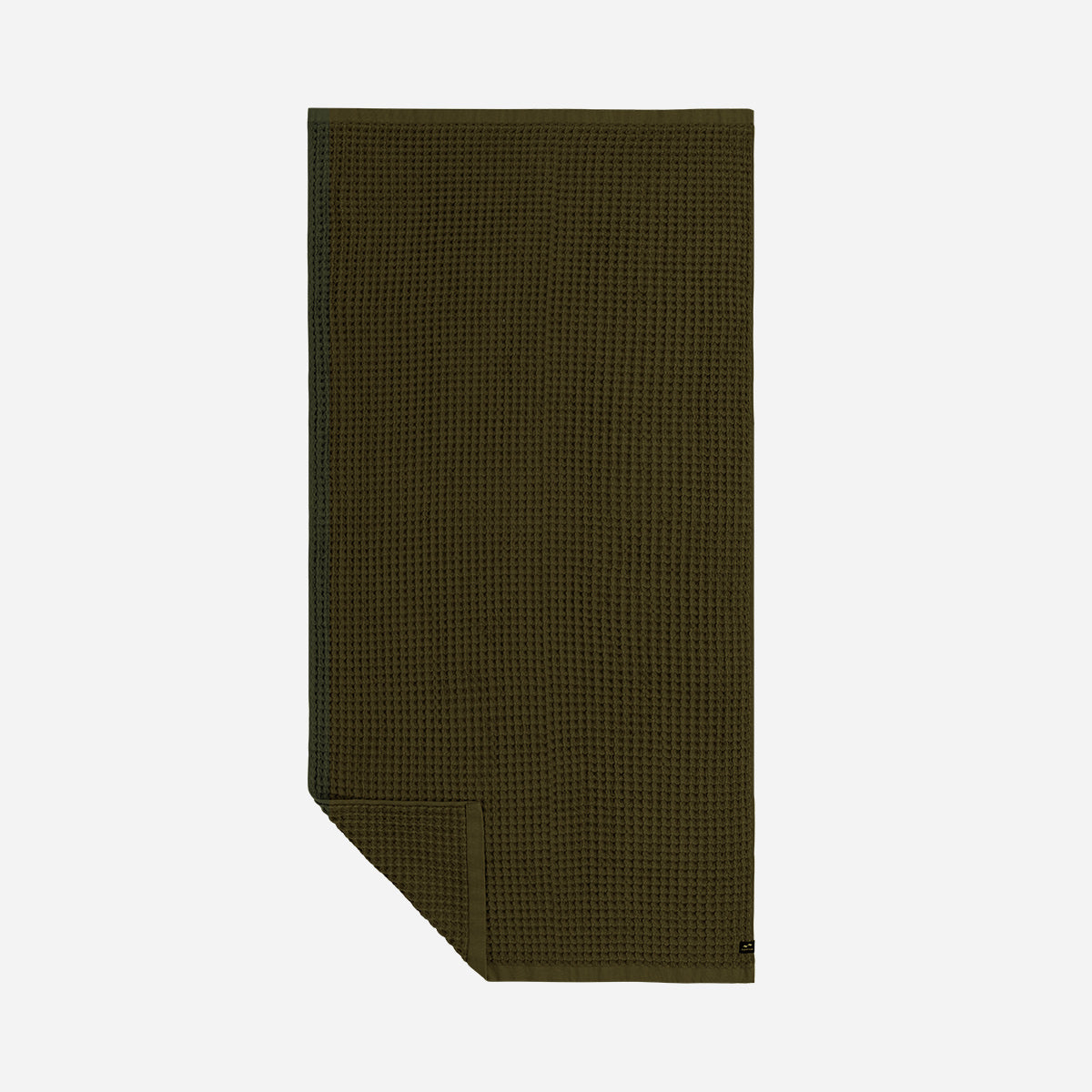 Quick dry olive green towel with waffle texture, neatly folded on plain background.