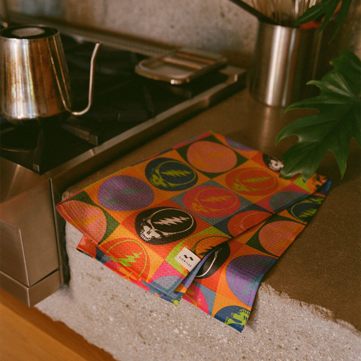 Quick-dry kitchen towel with bold allover graphic pattern on a countertop.