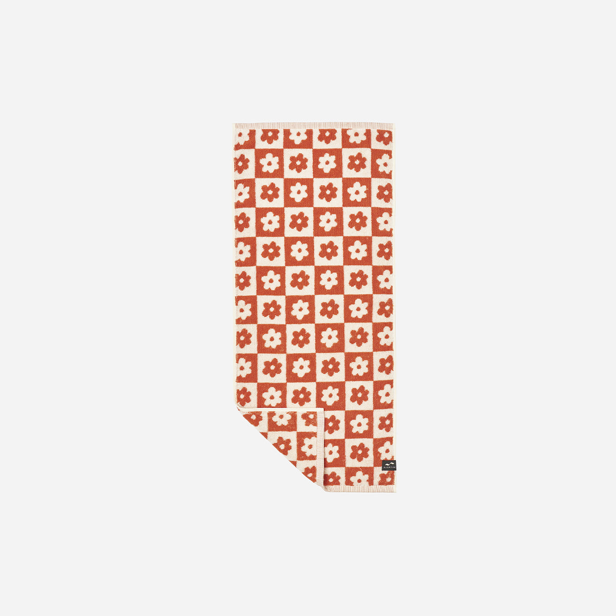 Hand towel, sustainable cotton, red and white floral geometric pattern.