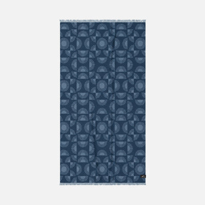 Turkish towel, dark blue indigo with sunburst and arch patterns, fringed ends.