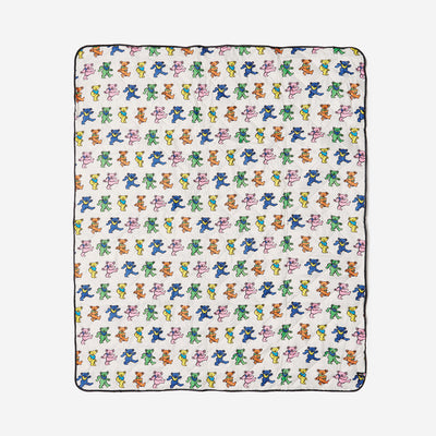 Blanket with colorful bear pattern on white, lightweight for outdoor use.