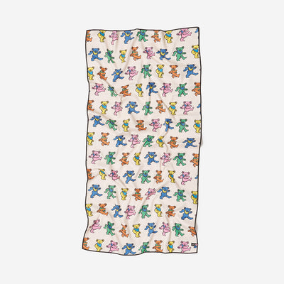 Quick-dry recycled towel with colorful dancing bears pattern on white background.