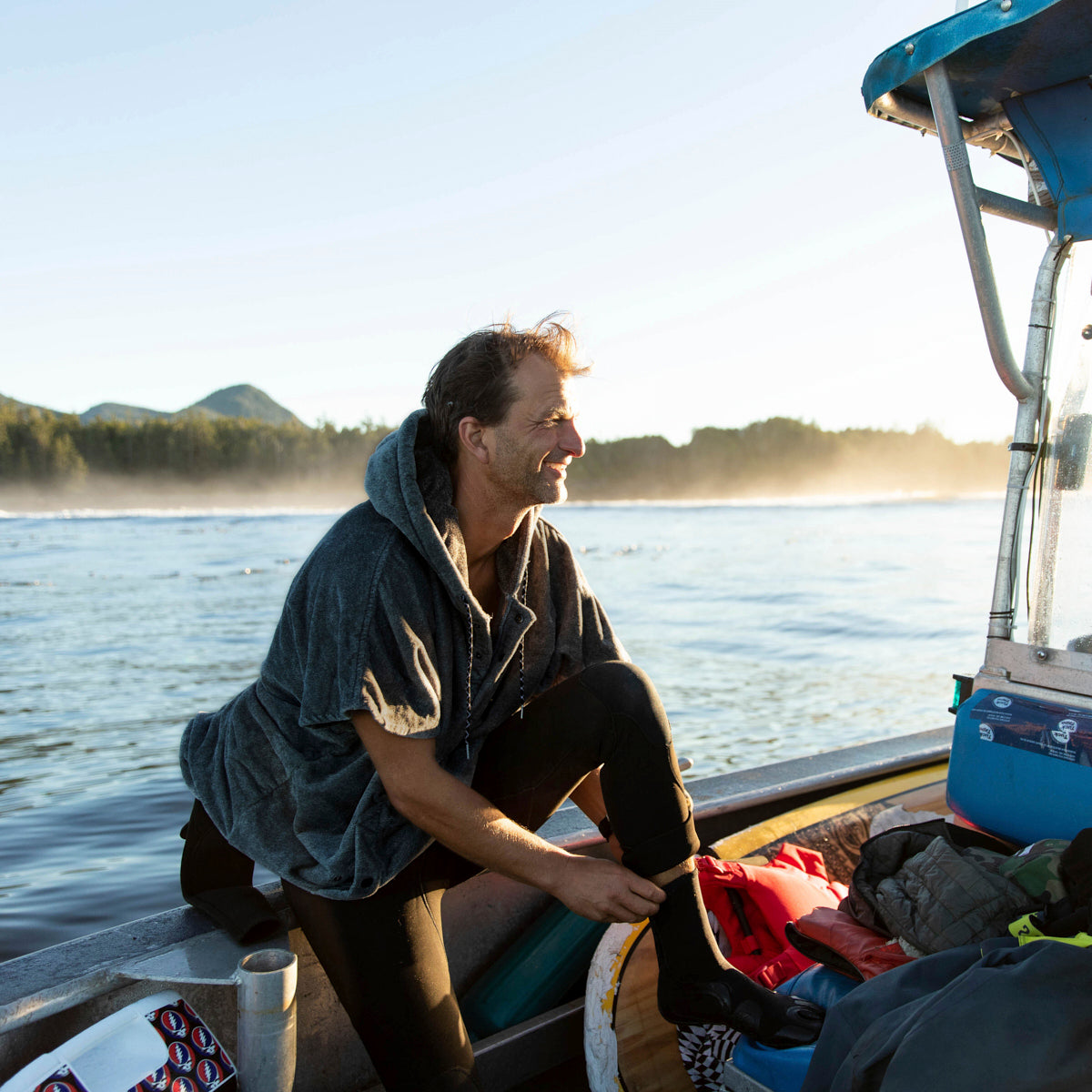 Heavyweight cotton terry changing poncho with hood, shown outdoors.
