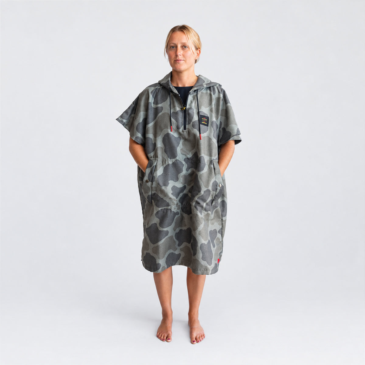 Camo-pattern surf changing poncho with front pockets.