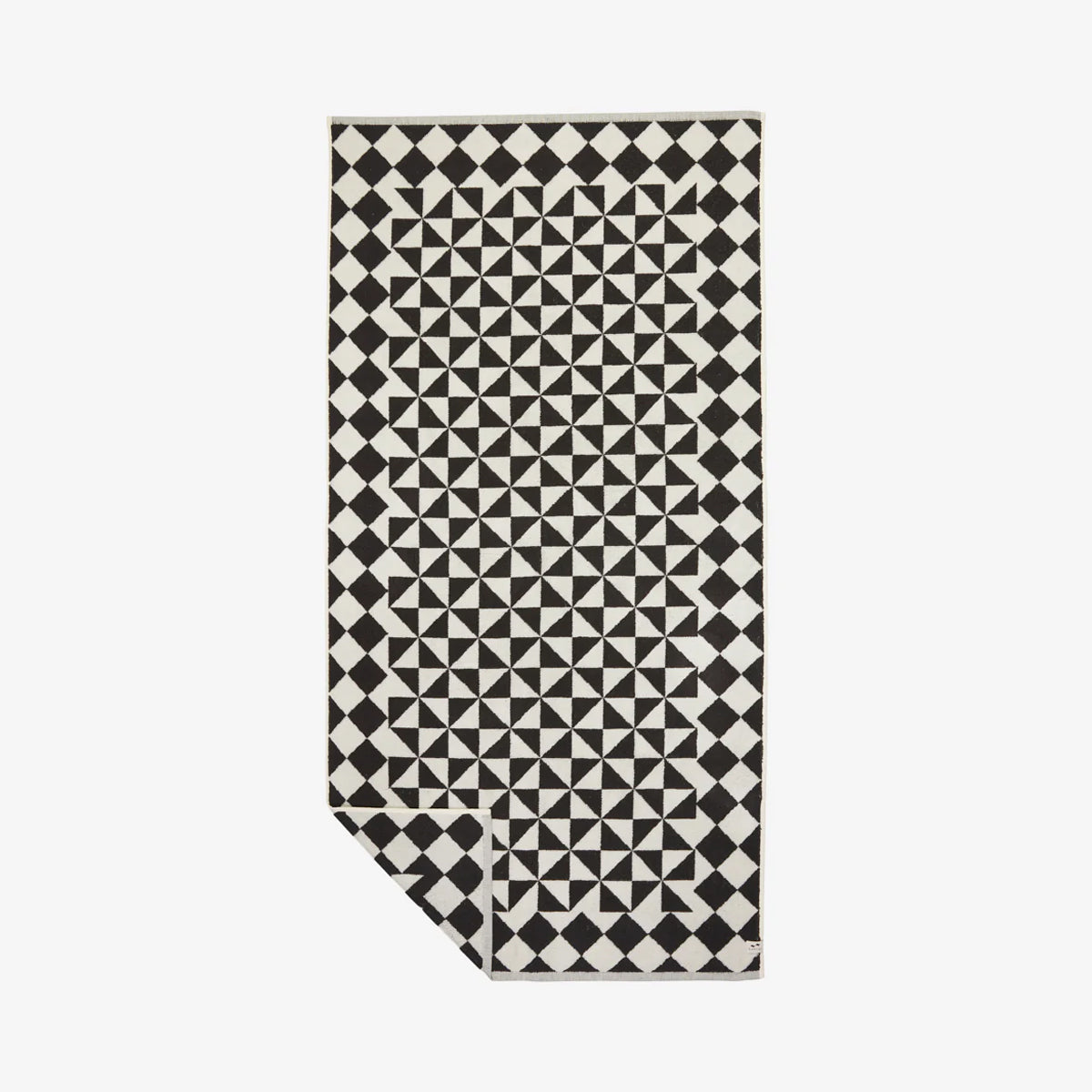 Black cotton bath towel with geometric pattern, 600 GSM, corner folded.