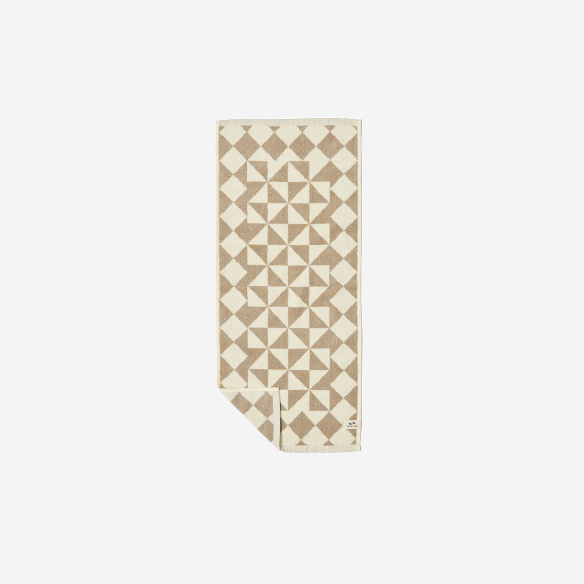 Cotton hand towel with geometric pattern, plush 600 GSM, folded on white surface.