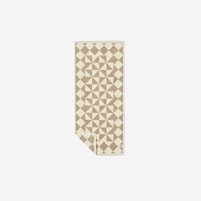 Cotton hand towel with geometric pattern, plush 600 GSM, folded on white surface.