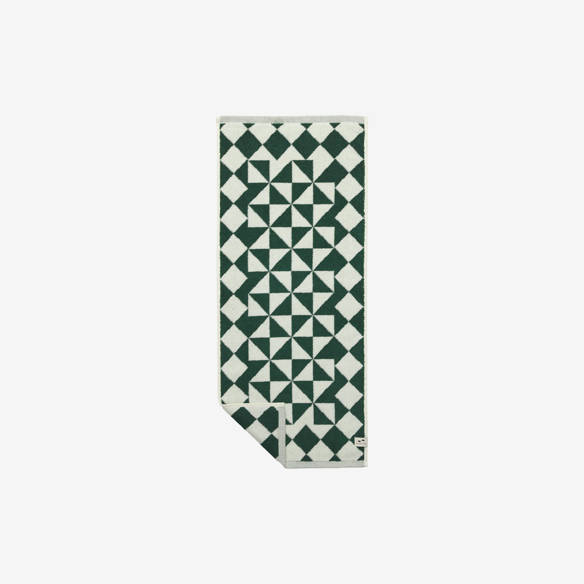 Hand towel, cotton, green and white geometric pattern, folded at one corner.