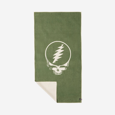 Quick-dry towel with graphic skull design, corner folded to display reverse side.