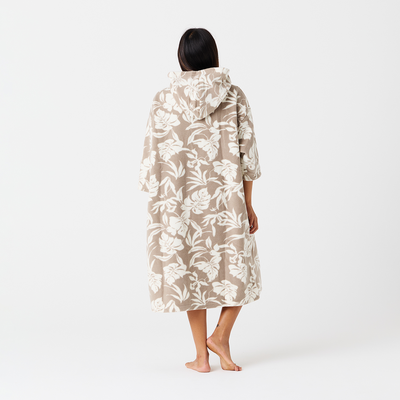 Fleece poncho with tropical print and floral-patterned hooded robe displayed together.