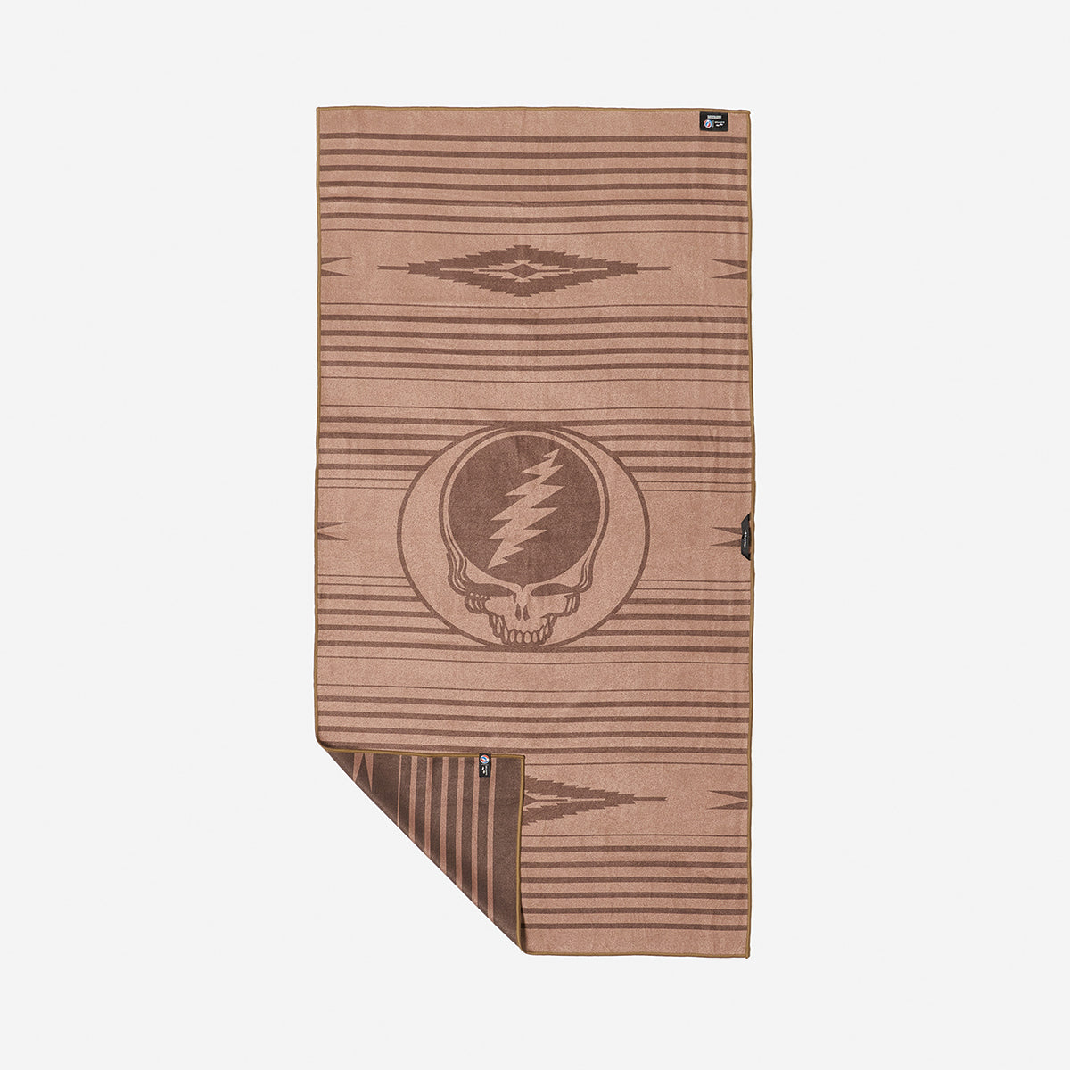 Quick-dry brown towel with geometric pattern and lightning skull logo on plain background.