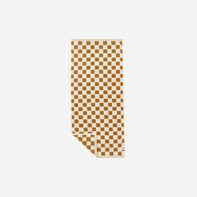 Towels with brown and beige checkered pattern, absorbent, folded for display.
