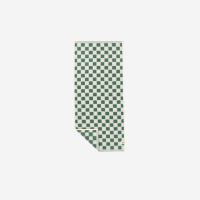 Oversized cotton towel with green and white checkered pattern.