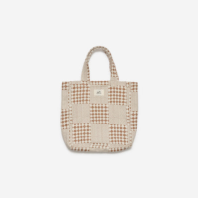 Tote bag in cotton canvas with a beige and brown geometric patchwork pattern.