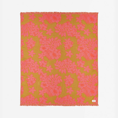 Beach towel, lightweight fabric with pink floral pattern and fringed edges displayed flat.