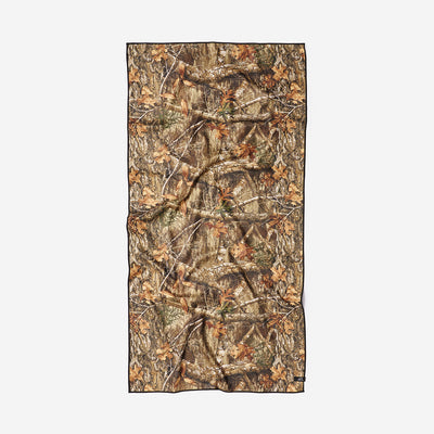 Woodland camo quick-dry towel with brown and green rectangle pattern.