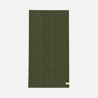 Olive green quilted cotton mat with plush texture and small white tag.
