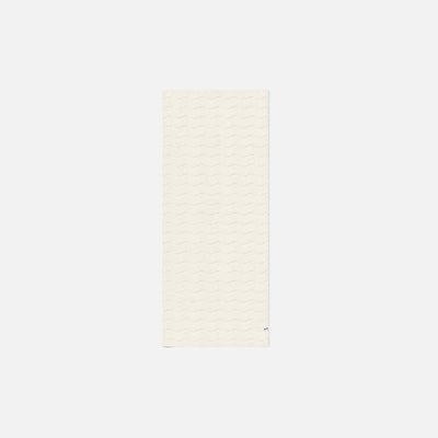 Off-white sculpted hand towel, rectangular cotton, plain background.