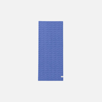 Blue cotton bath towel, plush texture.