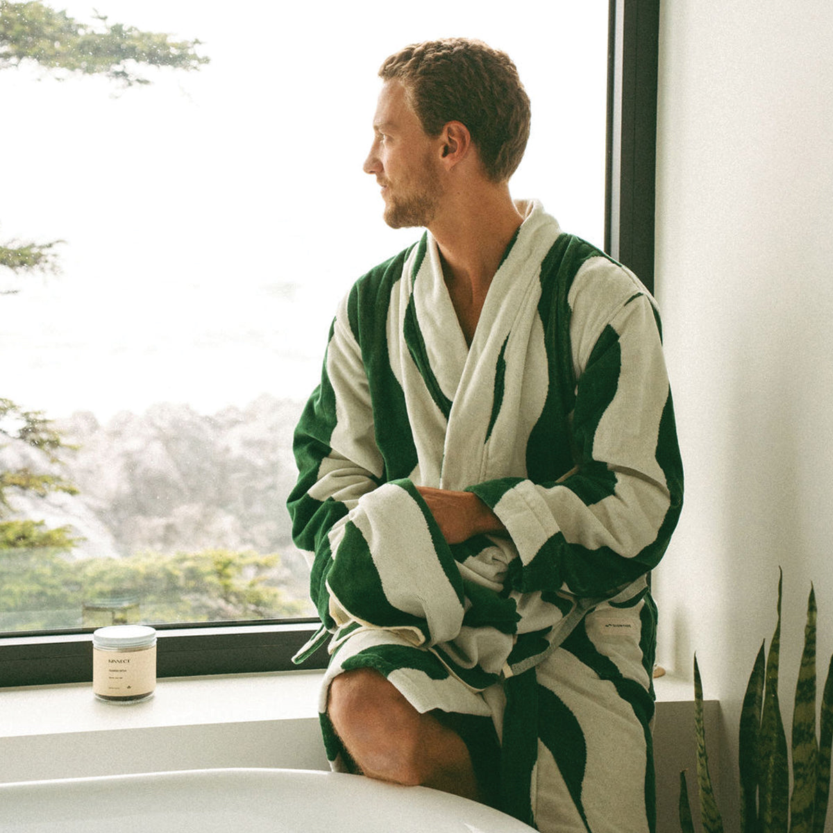 Cotton bathrobe in a green and white stripe pattern.