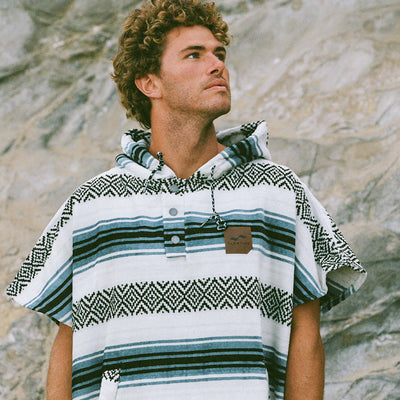 Striped absorbent cotton changing robe with hood, outdoor setting.