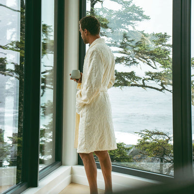 Plush cotton robe in cream featuring a textured finish and waist tie.