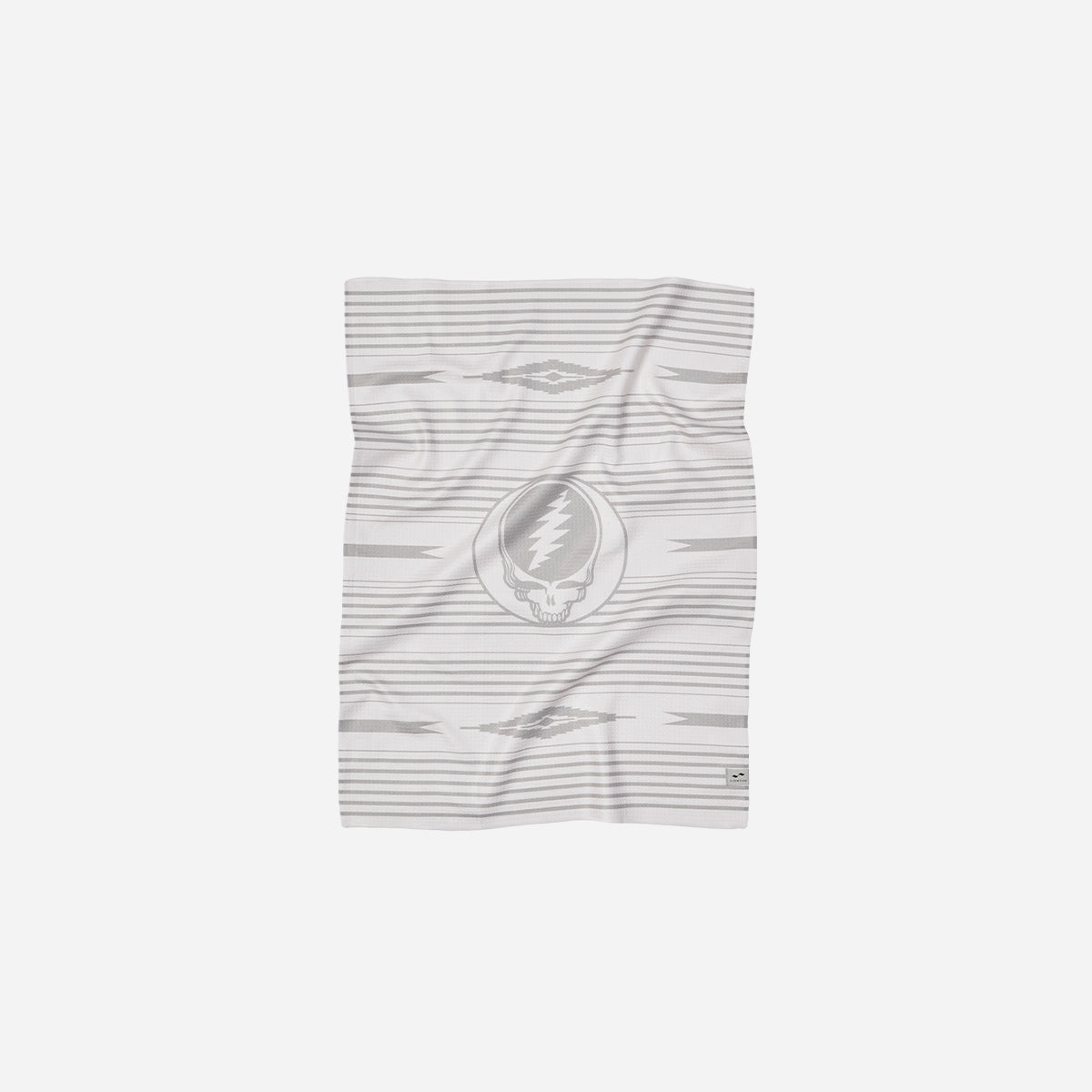Kitchen towel with gray and white geometric patterns and skull logo.