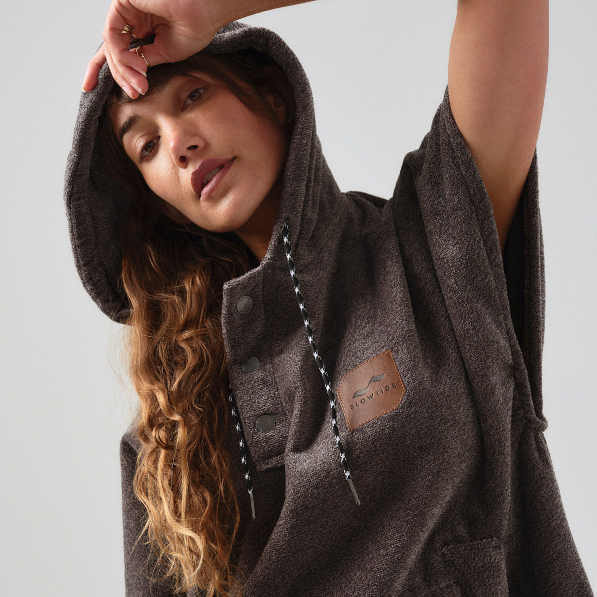 Heavyweight cotton terry changing poncho with patch detailing.