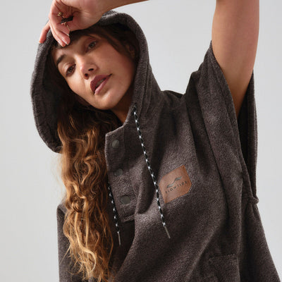 Heavyweight cotton terry changing poncho with patch detailing.