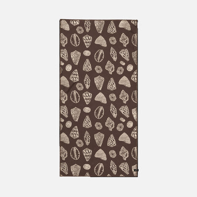 Sand-free towel with beige seashell pattern, brown color, rectangular shape.